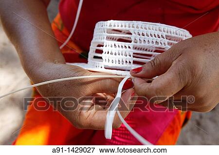 French Polynesia, Austral Islands archipelago, Raivavae, straw hat making View Large Photo Image Stock Photo - French Polynesia, Austral Islands archipelago, Raivavae, straw hat making. Fotosearch