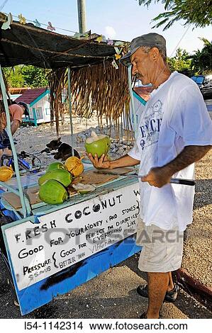 Fresh coconut milk stand in Grand Cayman Islands Caribbean View Large Photo Image Picture - Fresh coconut milk stand in Grand Cayman Islands Caribbean. Fotosearch