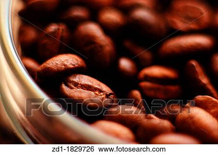 Stock Photograph - Fresh coffee beans in a jar. Fotosearch
