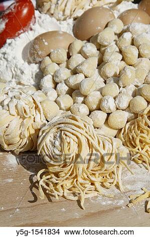 fresh italian pasta and gnocchi being prepared in kitchen View Large Photo Image Picture - fresh italian pasta and gnocchi being prepared in kitchen. Fotosearch