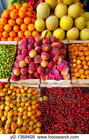 Fresh peaches, apricots & cherries on a fruit market stall, Syros, Greece View Large Photo Image Stock Photo - Fresh peaches, apricots & cherries on a fruit market stall, Syros, Greece. Fotosearch