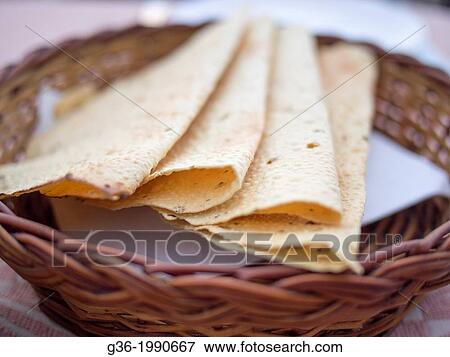 Fresh roasted poppadum in basket at Udaipur, Rajasthan, India. View Large Photo Image Stock Photo - Fresh roasted poppadum in basket at Udaipur, Rajasthan, India.. Fotosearch
