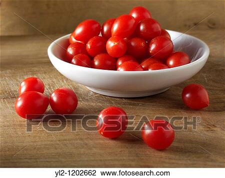 Stock Image - Fresh Tom Tom tomatoes. Fotosearch