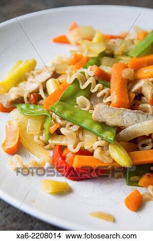 Picture - Freshly prepared vegetable and noodle stir fry.. Fotosearch