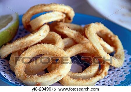 fried calamari, fried squid with lemon. View Large Photo Image Stock Photography - fried calamari, fried squid with lemon.. Fotosearch