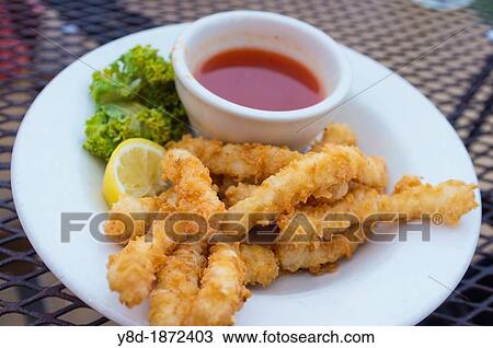 Fried calamari with hot sauce dish View Large Photo Image Stock Image - Fried calamari with hot sauce dish. Fotosearch