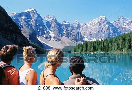Friends admiring Moraine Lake. Banff National Park. Canada View Large Photo Image Stock Photo - Friends admiring Moraine Lake. Banff National Park. Canada. Fotosearch