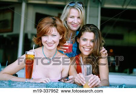 Stock Image - Friends at outdoor caf?. Fotosearch