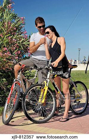 Friends cycling View Large Photo Image Stock Photo - Friends cycling. Fotosearch