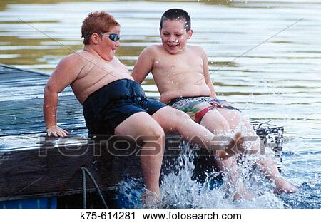 Friends enjoying the water View Large Photo Image Stock Image - Friends enjoying the water. Fotosearch