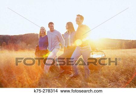Picture - Friends going to picnic. Fotosearch