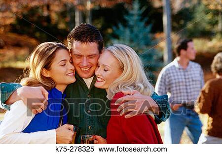 Stock Photography - Friends hugging. Fotosearch