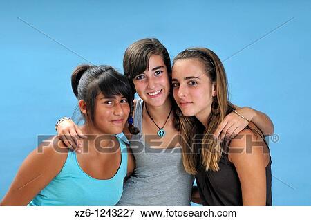 Friends hugging, with blue backgroud View Large Photo Image Stock Photo - Friends hugging, with blue backgroud. Fotosearch