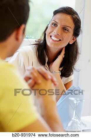 Picture - Friends in a restaurant. Fotosearch