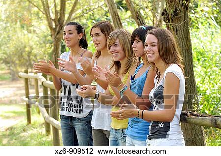 Stock Image - friends in the park. Fotosearch