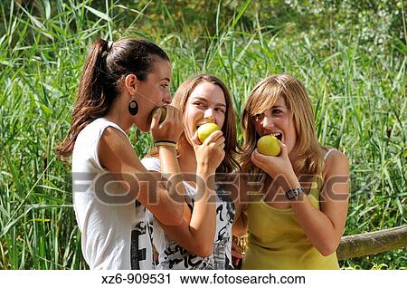 Stock Image - friends in the park. Fotosearch