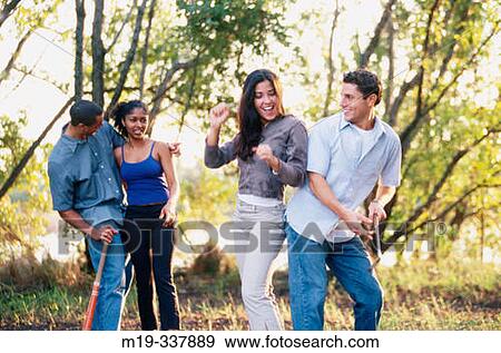 Stock Photo - friends outdoors enjoying life. Fotosearch