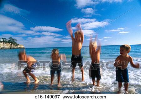 Friends playing together at the beach View Large Photo Image Stock Photo - Friends playing together at the beach. Fotosearch