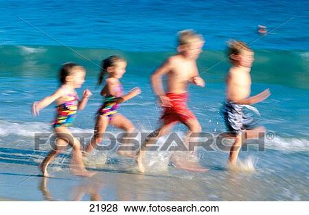 Stock Photo - Friends running at the beach. Fotosearch