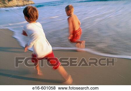 Friends running at the beach View Large Photo Image Stock Photo - Friends running at the beach. Fotosearch