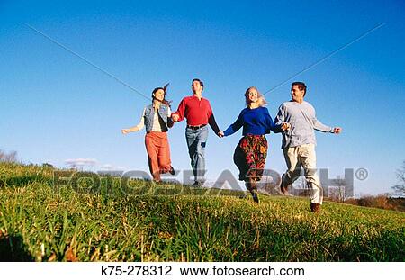 Friends running in the country View Large Photo Image Stock Image - Friends running in the country. Fotosearch