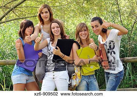 Stock Image - Friends showing thumbs up sign. Fotosearch