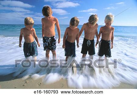 Friends standing in surf together View Large Photo Image Stock Image - Friends standing in surf together. Fotosearch