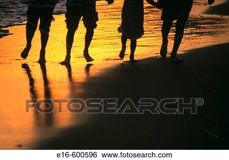 Stock Photograph - Friends walking on beach. Fotosearch