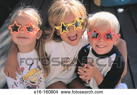 Friends wearing silly glasses View Large Photo Image Picture - Friends wearing silly glasses. Fotosearch