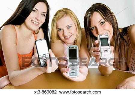 friends with mobile phones View Large Photo Image Stock Image - friends with mobile phones. Fotosearch