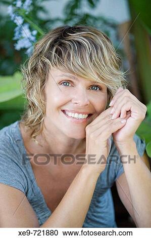 Stock Image - Fritzi smiling portrait head supported. Fotosearch