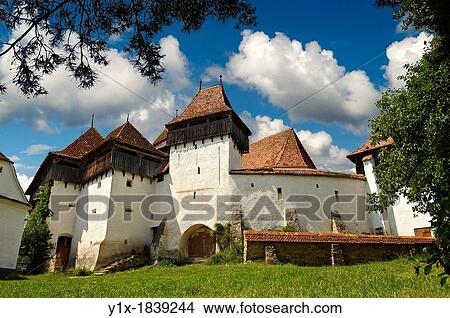 Picture - Front view of the Szekly medieval fortified church of Viscri, Bunesti, Brasov, Transylvania. Started in the 1100? s. UNESCO World Heritage Site. Fotosearch