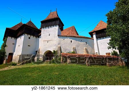 Front view of the Szekly medieval fortified church of Viscri, Bune? ti, Bra? ov, Transylvania Started in the 1100's UNESCO World Heritage Site View Large Photo Image Stock Photography - Front view of the Szekly medieval fortified church of Viscri, Bune? ti, Bra? ov, Transylvania Started in the 1100's UNESCO World Heritage Site. Fotosearch