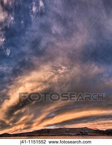 Frontal weather system from SW moves high over Lake Heron sheep & cattle station at dawn, autumn, Canterbury, New Zealand View Large Photo Image Stock Image - Frontal weather system from SW moves high over Lake Heron sheep & cattle station at dawn, autumn, Canterbury, New Zealand. Fotosearch