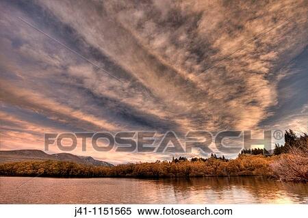 Frontal weather system from SW moves high over Lake Heron sheep & cattle station at dawn, autumn, Canterbury View Large Photo Image Stock Photography - Frontal weather system from SW moves high over Lake Heron sheep & cattle station at dawn, autumn, Canterbury. Fotosearch