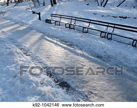 Stock Photograph - Frozen pedestrian walk in a park.. Fotosearch