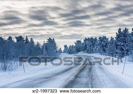 Stock Image - Frozen road in Finland.. Fotosearch