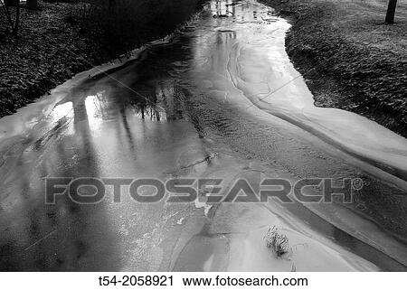 Frozen stream thawing View Large Photo Image Stock Image - Frozen stream thawing. Fotosearch