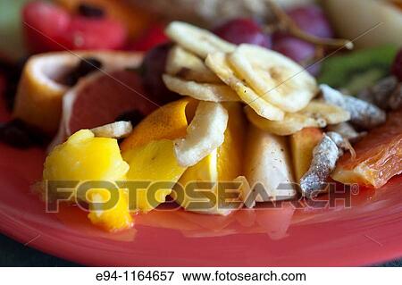 Stock Photo - Fruit salad on a plate in a restaurant. Fotosearch