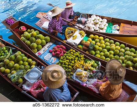 Fruit seller in the Damnoen Saduak floating market, 100 km away from Bangkok Thailand. View Large Photo Image Stock Image - Fruit seller in the Damnoen Saduak floating market, 100 km away from Bangkok Thailand.. Fotosearch