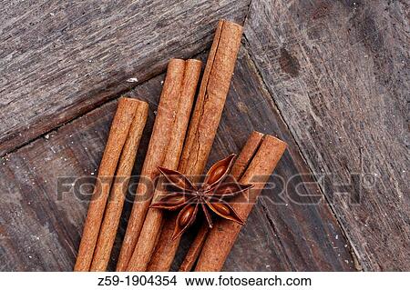 fruits of star anise - Illicium verum - cinnamon sticks in wooden bowl - Cinnamomum cassia View Large Photo Image Picture - fruits of star anise - Illicium verum - cinnamon sticks in wooden bowl - Cinnamomum cassia. Fotosearch