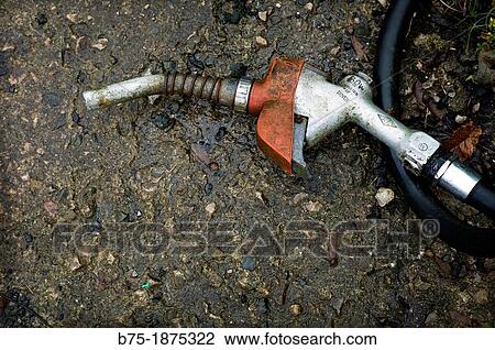 Stock Image - fuel hose lying on the floor. Fotosearch