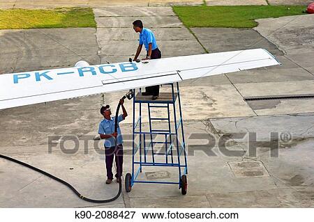 Stock Photo - Fuel uplift for a small aircraft at Jayapura International Airport """"Sentani"""", Papua, Indonesia, Southeast Asia. "". Fotosearch
