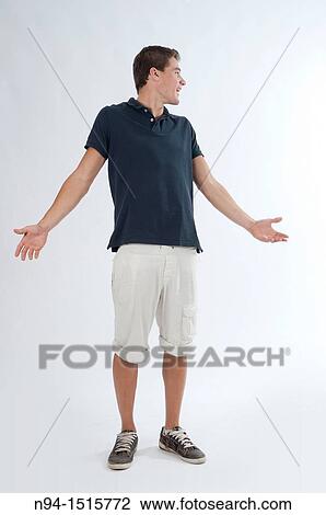 Full-body photograph of a teenage boy standing with his hands and open arms. View Large Photo Image Stock Image - Full-body photograph of a teenage boy standing with his hands and open arms.. Fotosearch