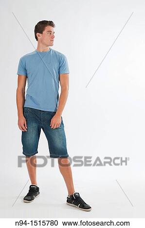 Stock Image - Full-body photograph of a teenage boy standing.. Fotosearch