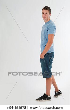 Stock Image - Full-body photograph of a teenage boy standing.. Fotosearch