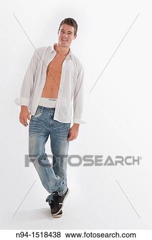 Full-body photograph of a teenage boy in jeans and white shirt open. View Large Photo Image Stock Photo - Full-body photograph of a teenage boy in jeans and white shirt open.. Fotosearch