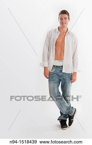 Full-body photograph of a teenage boy in jeans and white shirt open. View Large Photo Image Stock Photo - Full-body photograph of a teenage boy in jeans and white shirt open.. Fotosearch
