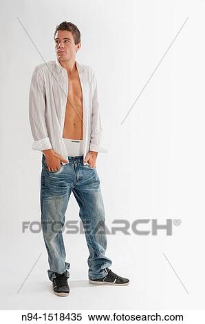 Full-body photograph of a teenage boy in jeans and white shirt open. View Large Photo Image Stock Photography - Full-body photograph of a teenage boy in jeans and white shirt open.. Fotosearch