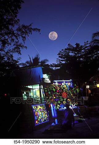 Stock Image - Full moon at dusk on Ko Phangan. Fotosearch